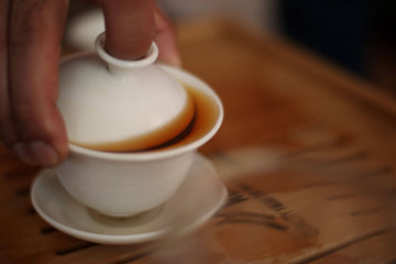 Nepali loose-leaf teas next to teas from Darjeeling, China, and Japan – comparison setup on rustic wooden table