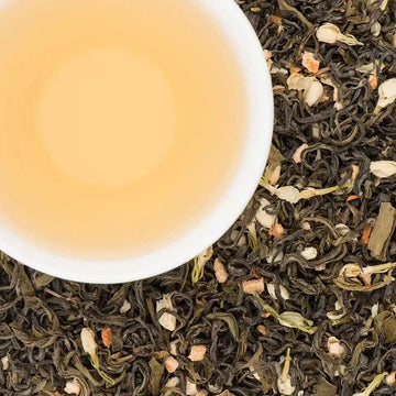 What does jasmine tea taste like - June Jasmine green tea blend with jasmine blossoms brewed in a cup by Nepali Tea Traders