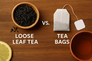 Comparison of loose leaf tea and tea bag on wooden surface with brewed tea and lemon slice