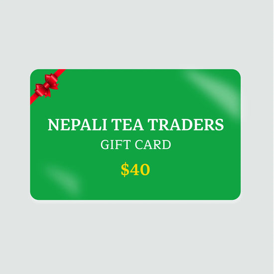 Green gift card for Nepali Tea Traders with a red ribbon on a light gray background